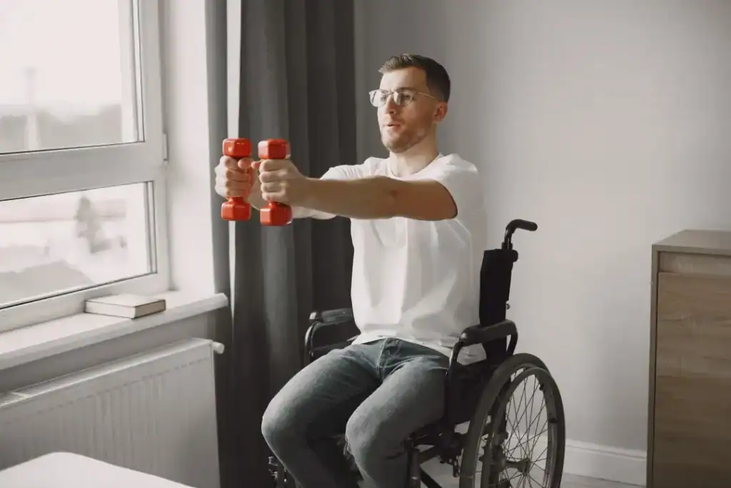 Image of man doing exercise in his wheelchair to aid weight loss Birmingham