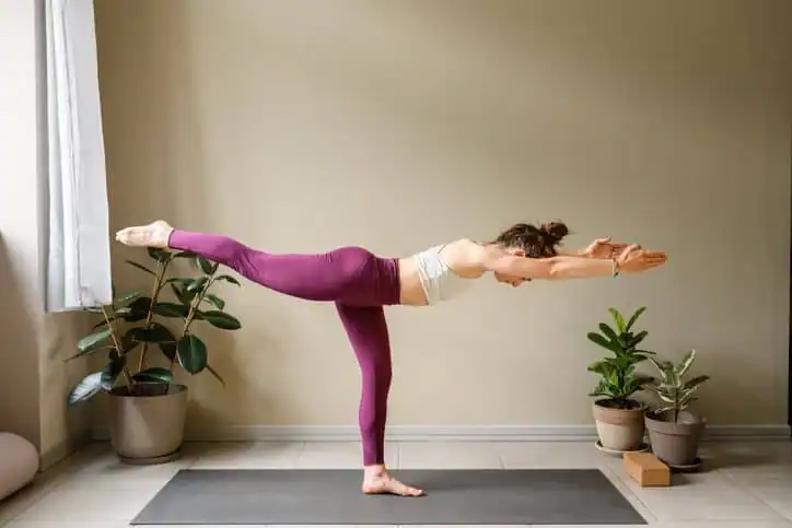 Achieving the Perfect Tone: How Often Should You Exercise for Results? 1 Woman doing Yoga exercise Birmingham to help with toning the body.