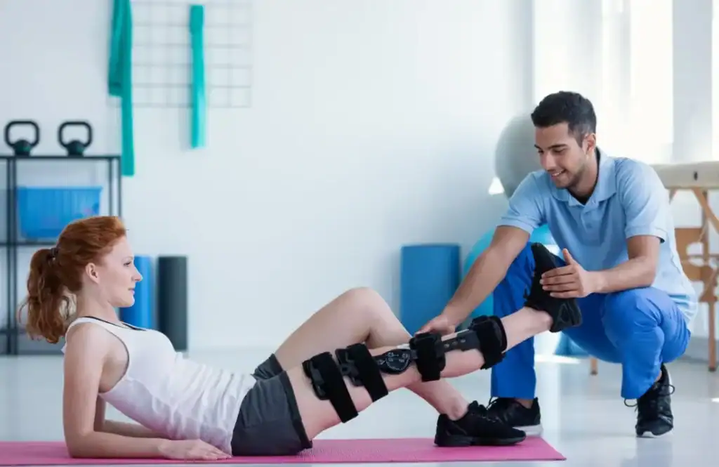 Debunking Meal Timing Myths: The Truth About Muscle Recovery 1 Woman having treatment to help muscle recovery Birmingham after an injury