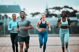 Sculpting Sleek Arms: The Essential Role of Cardio in Toning Without Bulking Up 3 image of people running to incorporate cardio Birmingham exercise into their life to help tone arms and body.