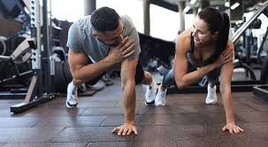 Image of man and woman doing Cardio Birmingham to tone their arms. 